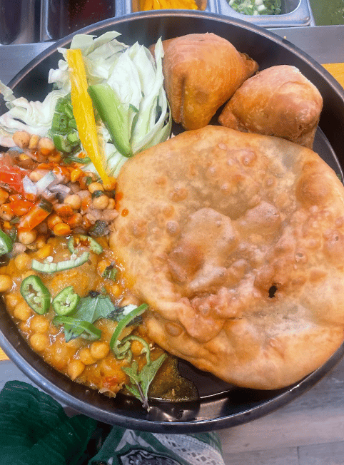 Full homestyle feast spread featuring authentic biryani and accompaniments